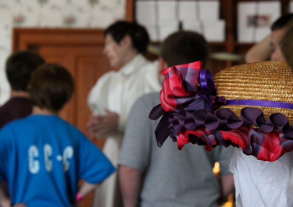 The presenter tells some visitors about the shop - Mrs. Cohen's Millinery, Greenfield Village The presenter tells some visitors about the shop - Mrs. Cohen's Millinery, Greenfield Village