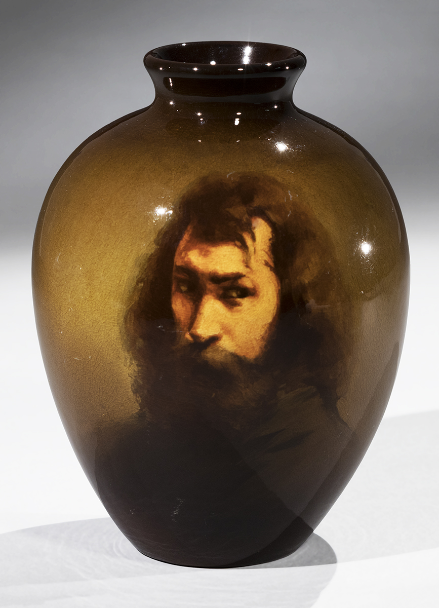 Brown vase with painted portrait of young man with long hair, beard, and mustache