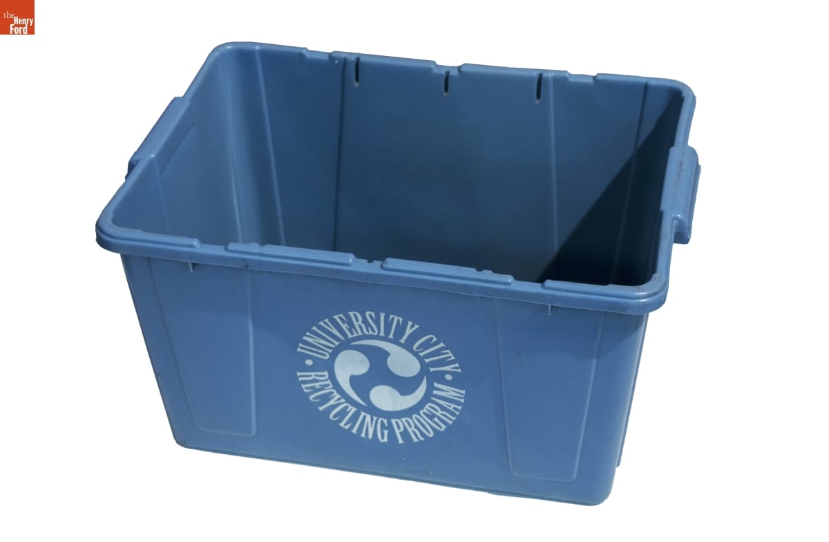 Blue bin with white text and logo that looks like three tadpoles