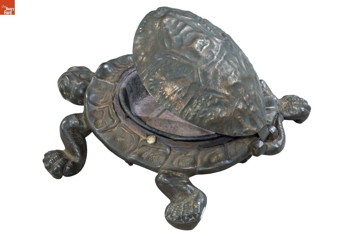 Metal turtle whose shell opens to reveal a bowl inside