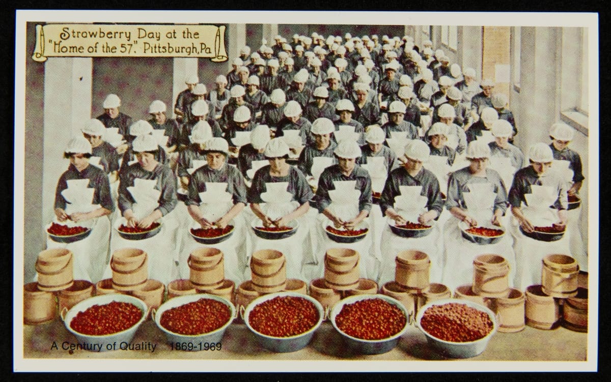Centennial Post Cards 1869-1969, H. J. Heinz Company, Pittsburgh, Pennsylvania / postcard 1 Postcard of a large group of women in white aprons and caps sorting strawberries, with large bowls of strawberries in the foreground
