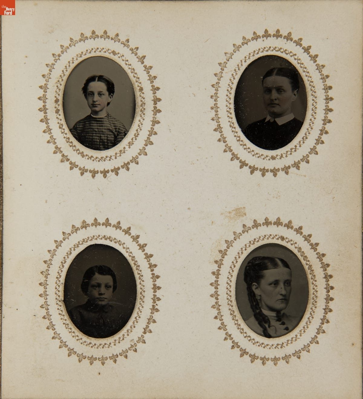 Page containing four oval head-and-shoulder portraits with decorative borders around each portrait