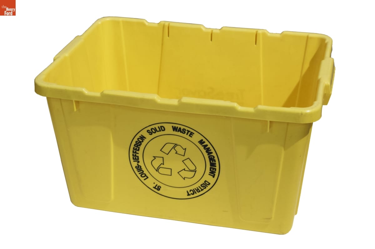 Yellow bin with black text and recycling logo on side