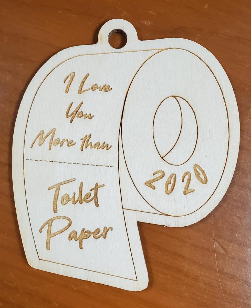 Wooden "I love you more than toilet paper" ornament Wooden cut-out in the shape of a roll of toilet paper; contains text