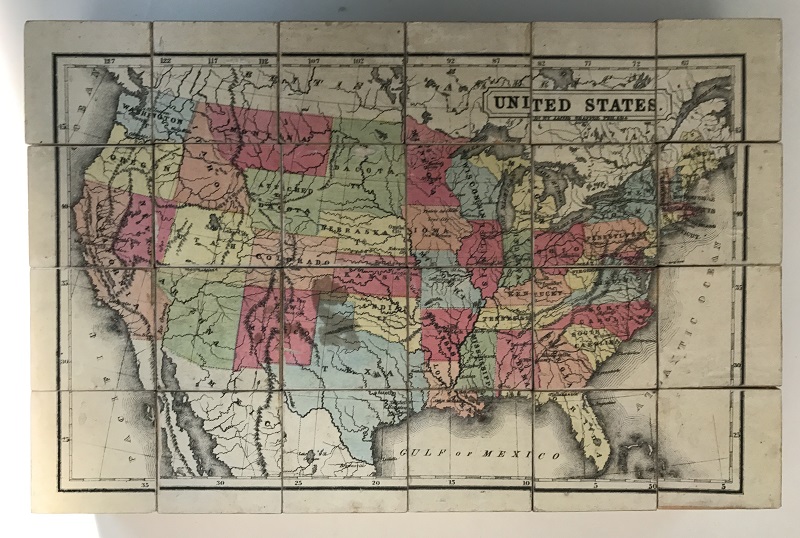Blocks arranged to show a line drawing of the United States, with states shaded in various colors