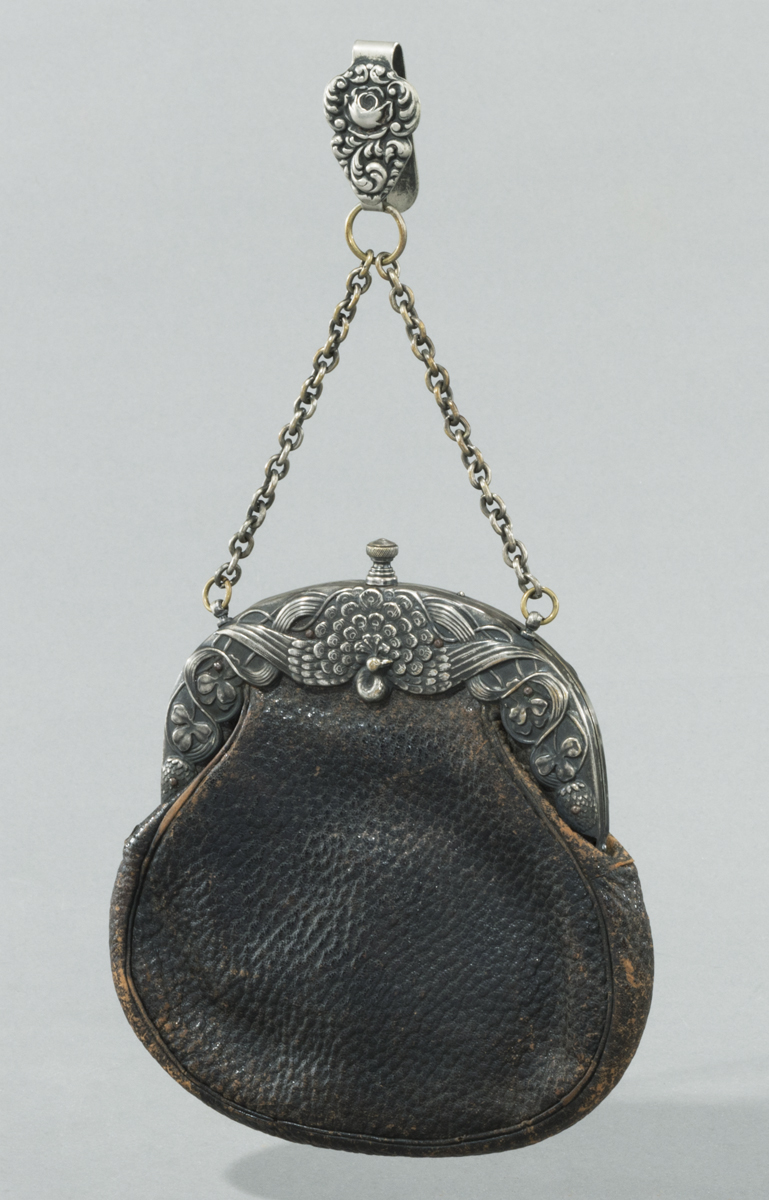 Brown pebbled leather handbag with elaborate silver clasp with a peacock in the center and a silver chain