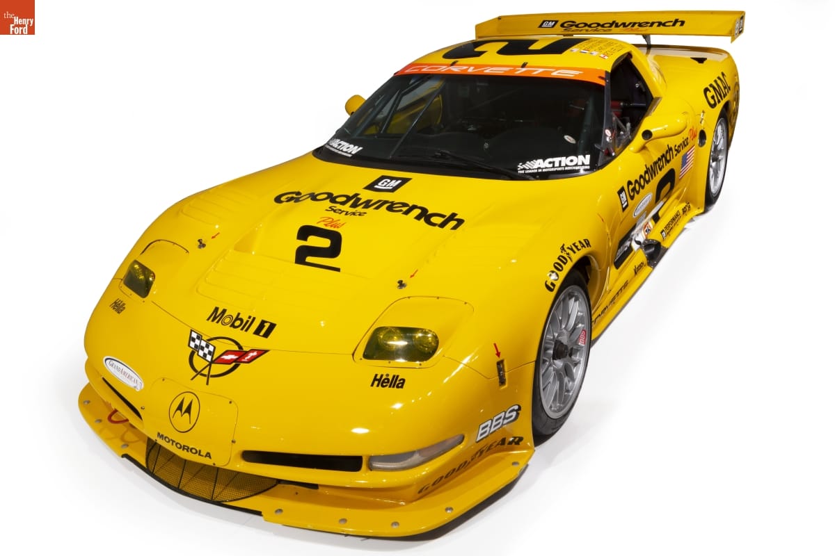 Low yellow race car with text and logos