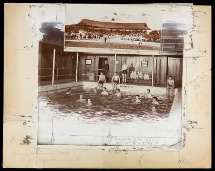 Photographs of people in swimming pool and a baseball game mounted on a large manila sheet with pencil markings