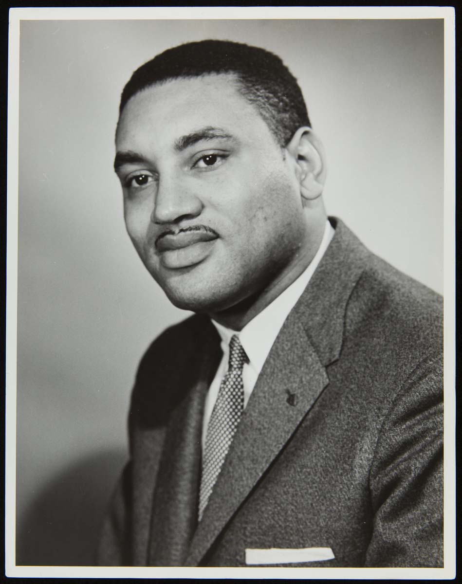 Torso and head of an African American man wearing a suit