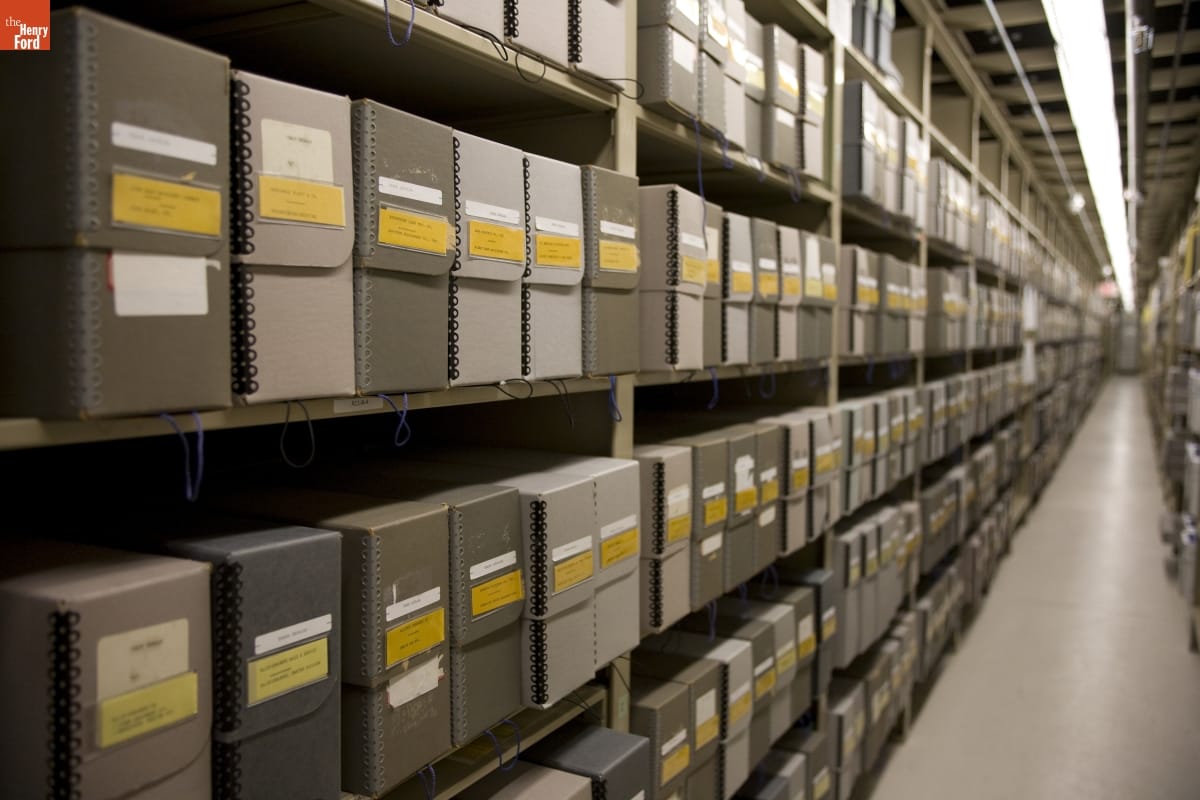 Collections Storage at Benson Ford Research Center, August 2006 Shelves packed with gray boxes with yellow labels receding into the distance