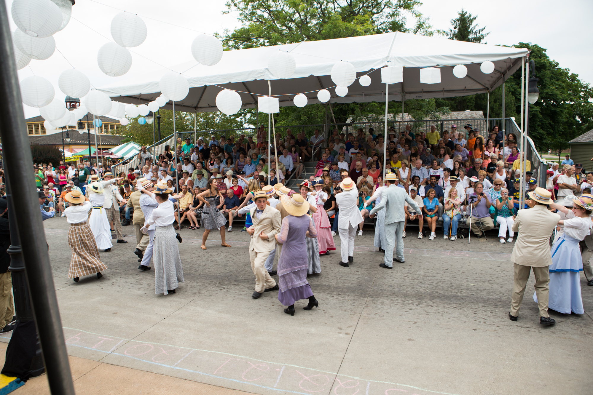 Ragtime dancing in Greenfield Village Dancers in vintage costumes on concrete road with crowd watching