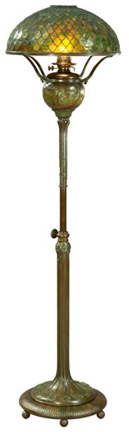 Lamp with bronze base and stem, and green and yellow "fishscale" patterned glass shade