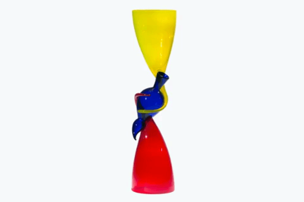 GIF of rotating glass artwork, red cuplike shapes on bottom and top, blue abstract shape in middle