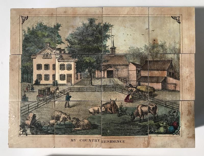 Blocks arranged together to show several buildings and a yard with farm animals, along with text "My Country Residence"