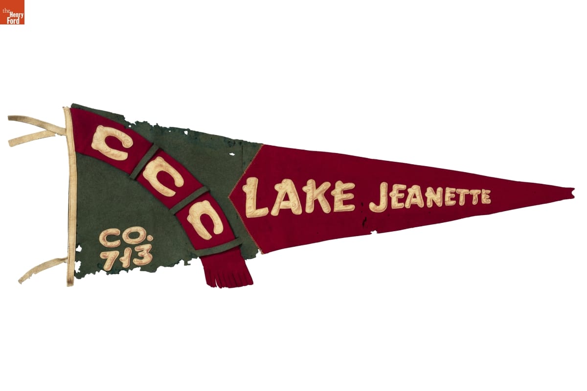 Gray and maroon pennant with text