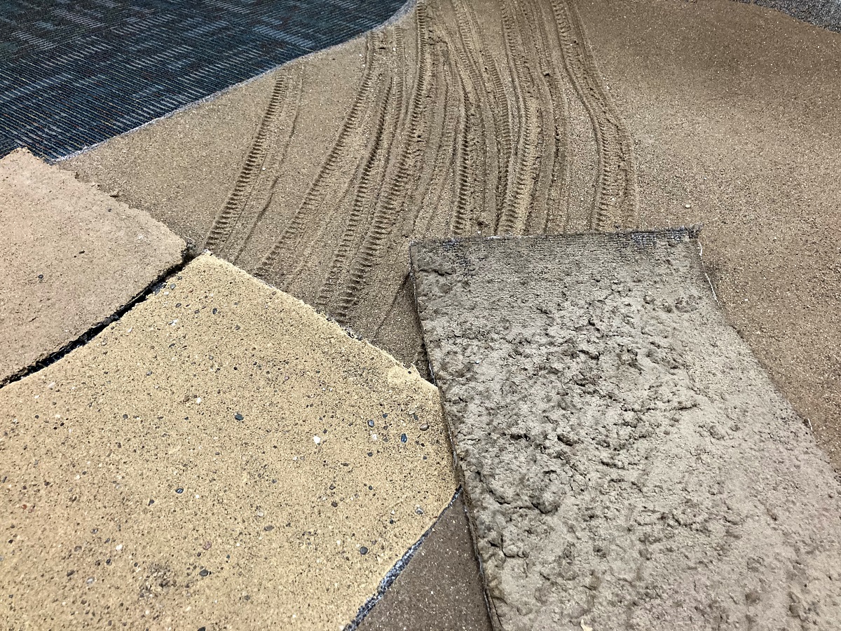 Tiles that look almost like carpet samples, but visually appear similar to dirt