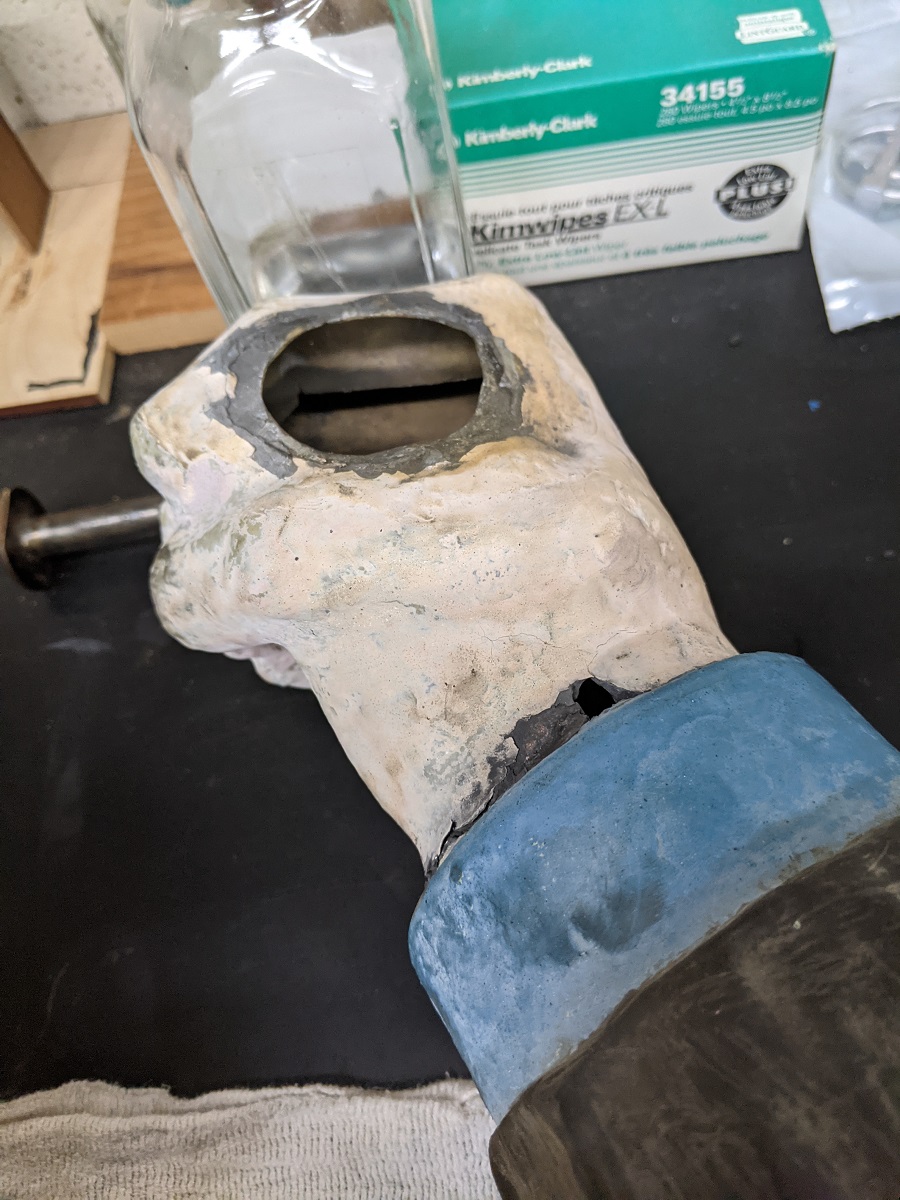 Painted hand and wrist shape with large hole in hand