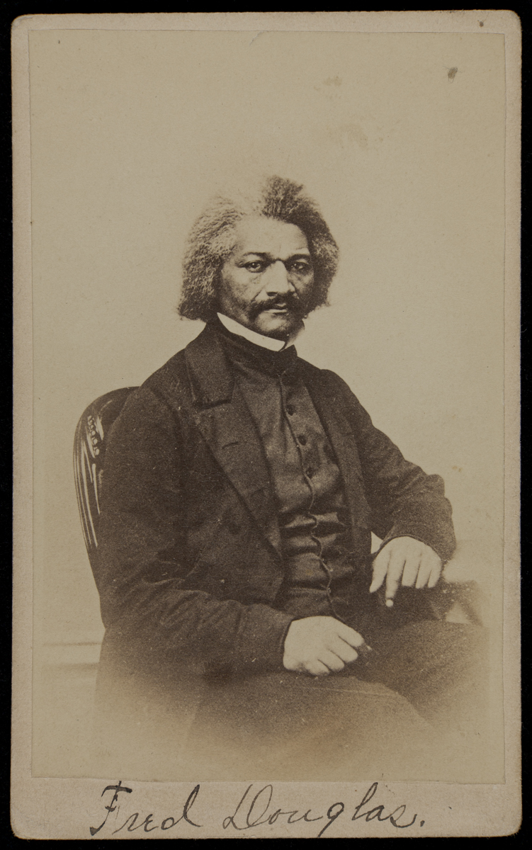 Portrait of Frederick Douglass, circa 1860 Sepia image of African American man in a suit seated in a chair; “Fred Douglas” handwritten along bottom