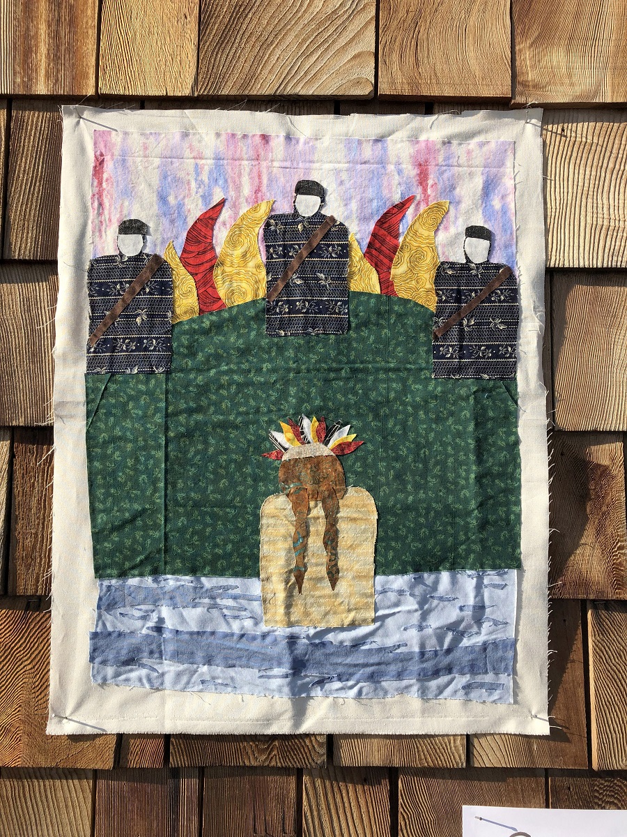 Fabric block depicting a figure wearing feathers on head in water, while three figures in black with bandoliers or sashes look on from a flame-topped hill