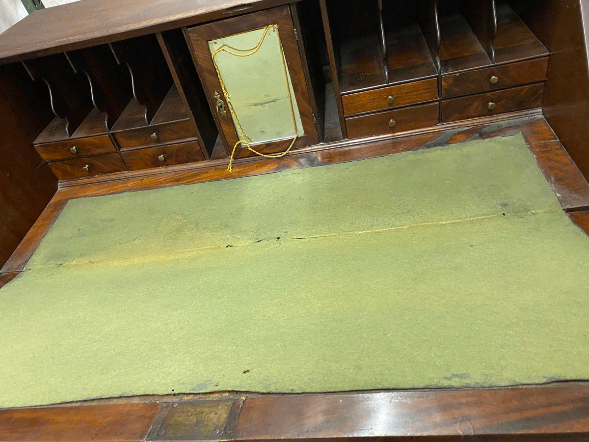 Open-desk Interior view showing the braided cord once attached to Gen. Grant’s uniform and now around the mirrored door.