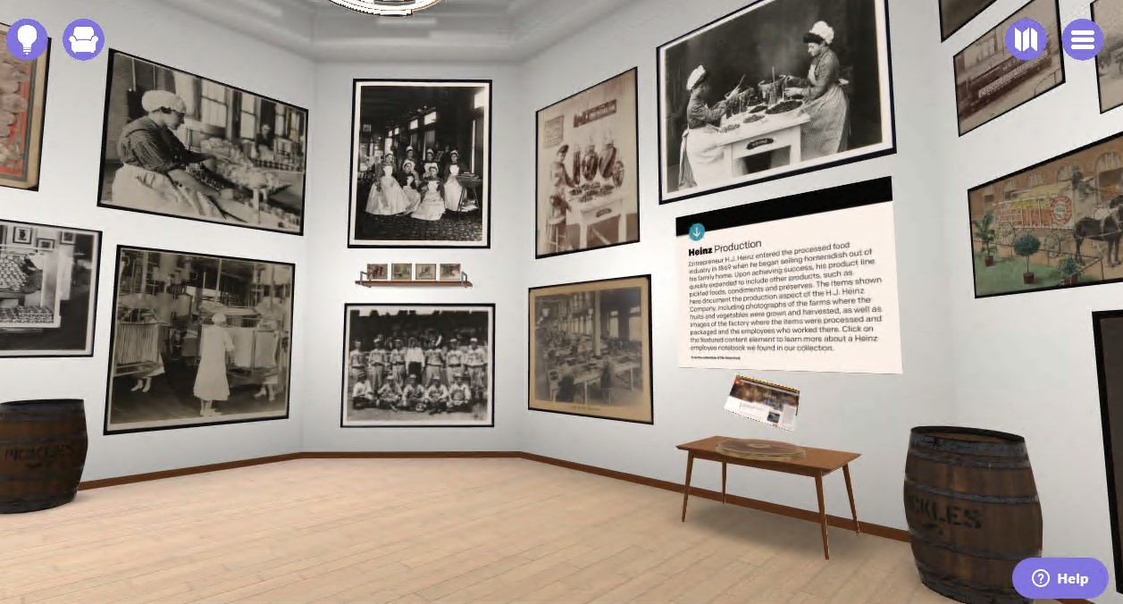 Virtual space with wood floor, white walls, and black-and-white images on the walls