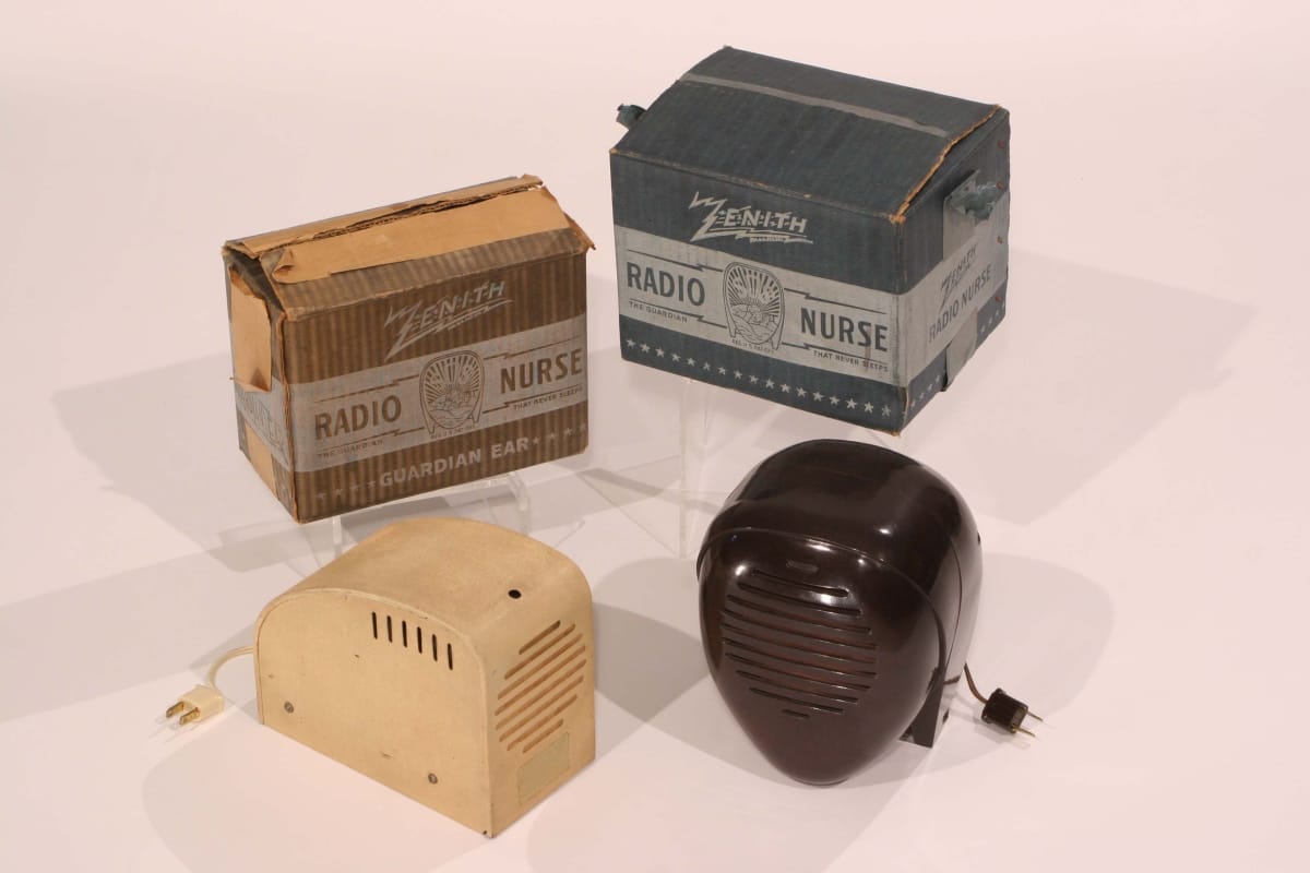 Four components: two boxes (each containing text), a beige piece with a plug and grille, and a teardrop-shaped piece with a plug and grille 