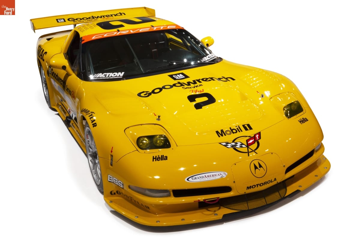 Low yellow race car with text and logos