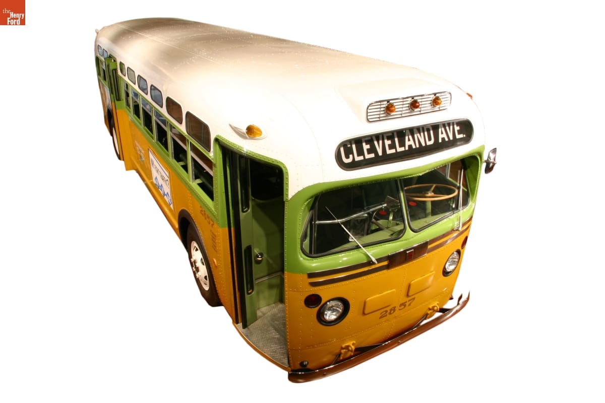 Rosa Parks Bus Lime green and mustard yellow bus with white roof; "Cleveland Ave" in destination window on front