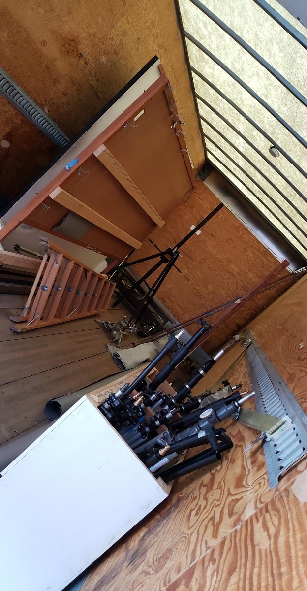 Box truck loaded up with our equipment Angled image of wooden interior of truck containing furnishings and equipment