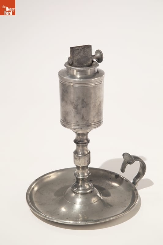 Pewter Oil Lamp, 1842-1847 Silver table lamp with base, stem, and loop for carrying