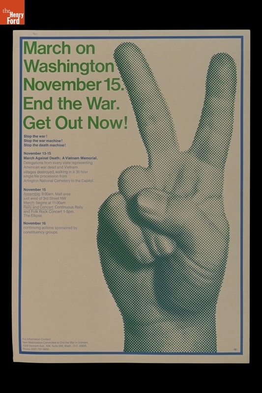 Poster with text and hand held up with fingers forming a "V"