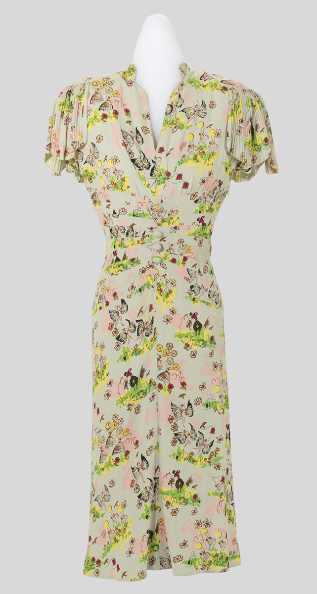 Beige dress with pattern of flowers and fairies, short flutter sleeves, and mid-calf skirt