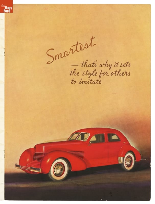 Image of red car on gold and black background; contains text