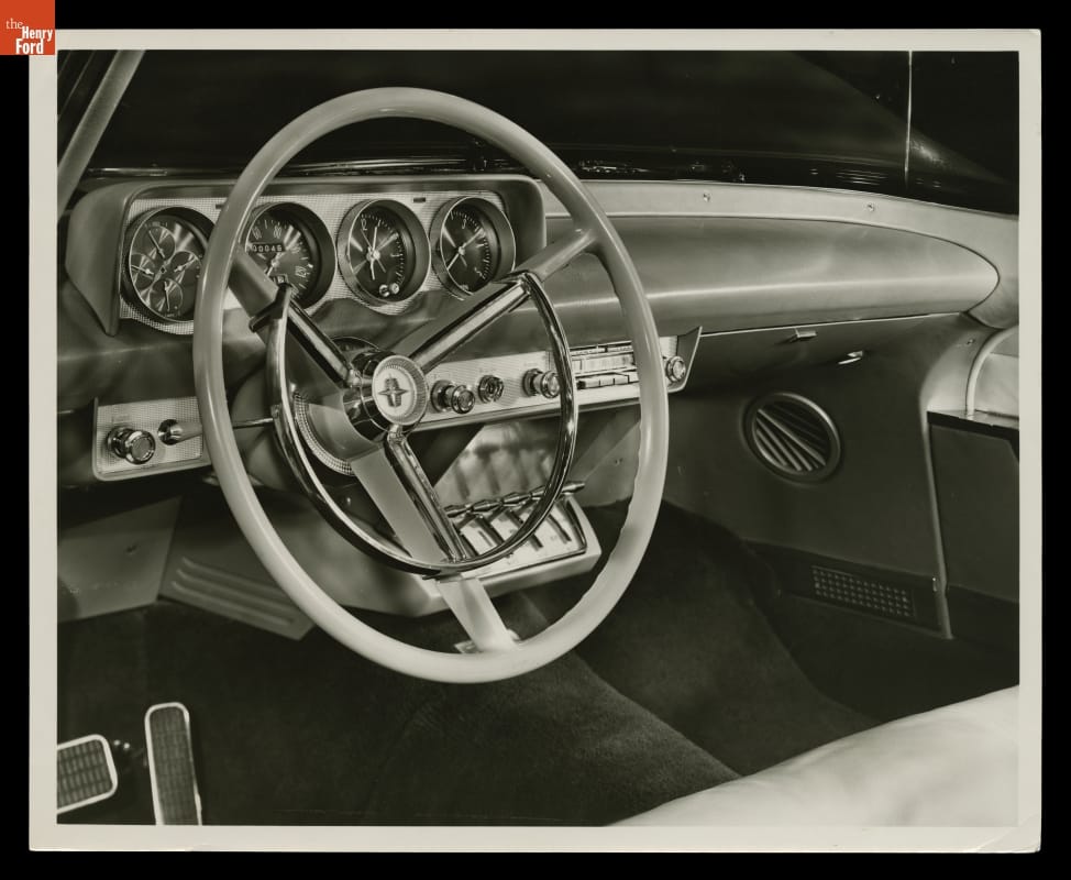 Car dashboard with large steering wheel