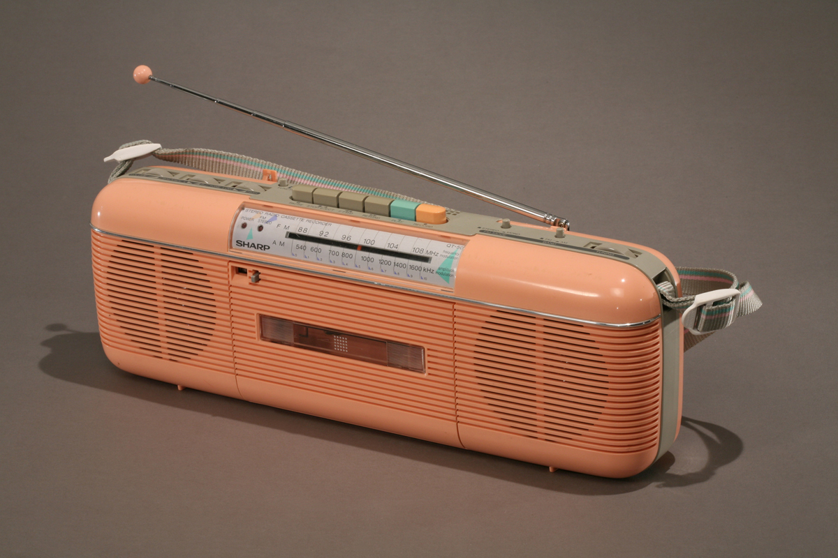 Long peach-colored cassette player and radio with antenna