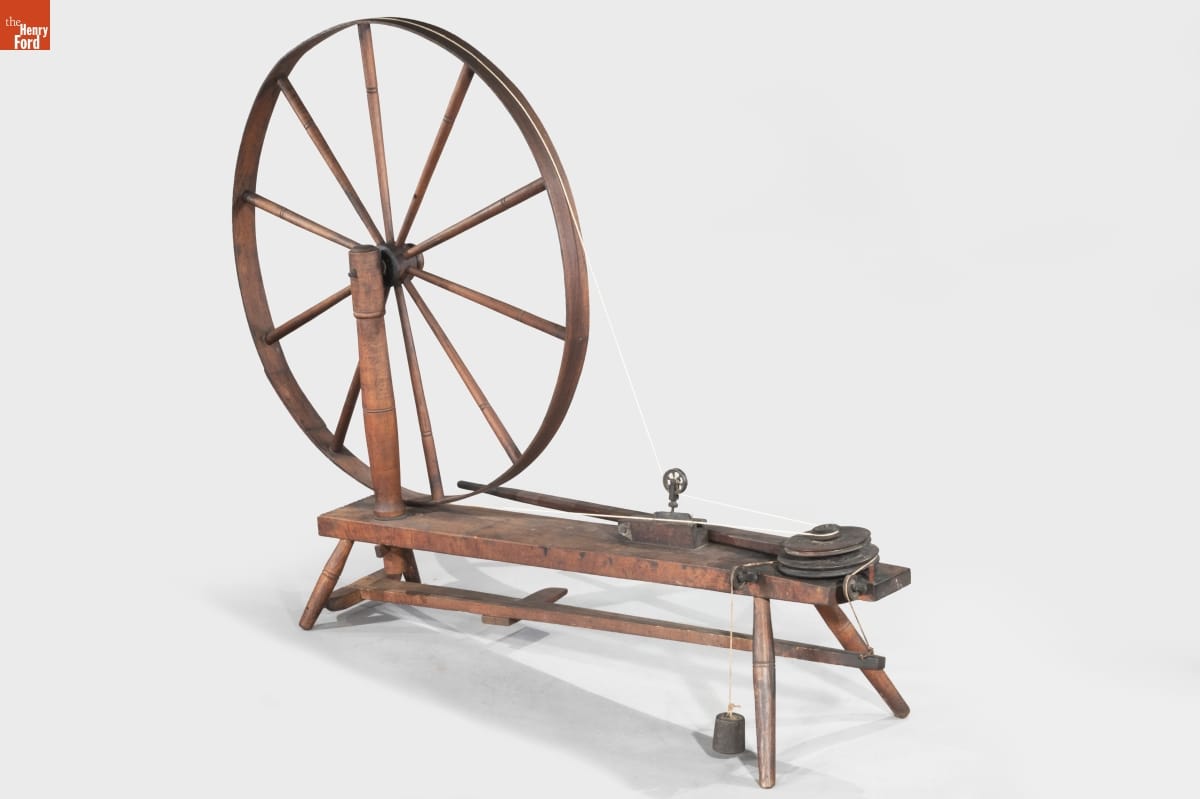 Wool Wheel, 1860-1880 Wooden spinning wheel with a large wheel and flat bench-like area