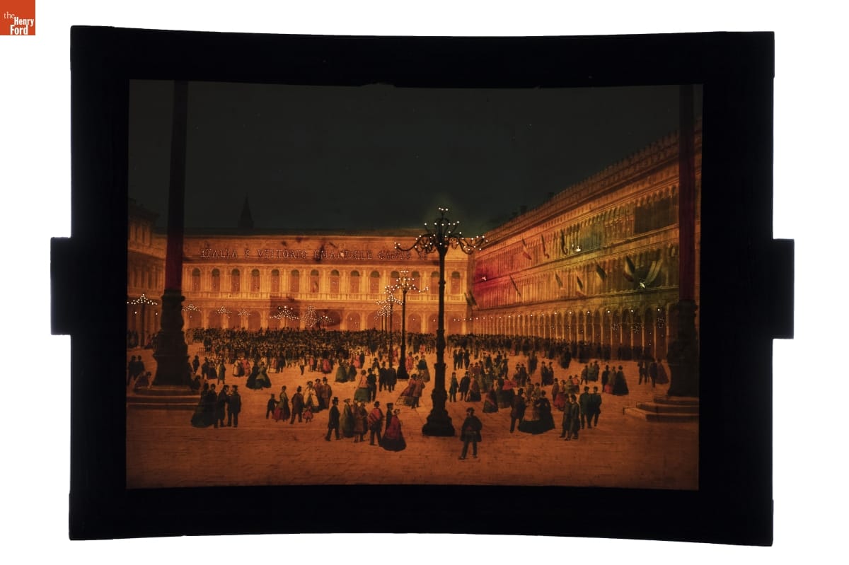 Image of building wrapped around a public square filled with people