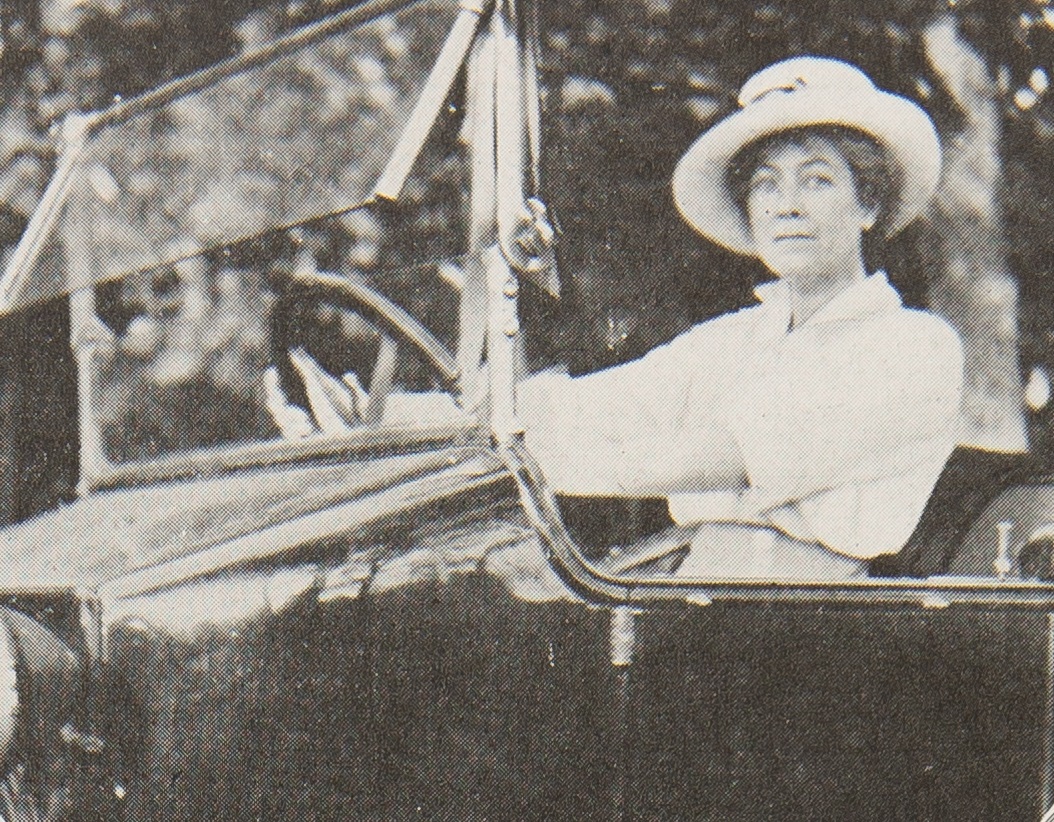 Woman behind the wheel of an open car