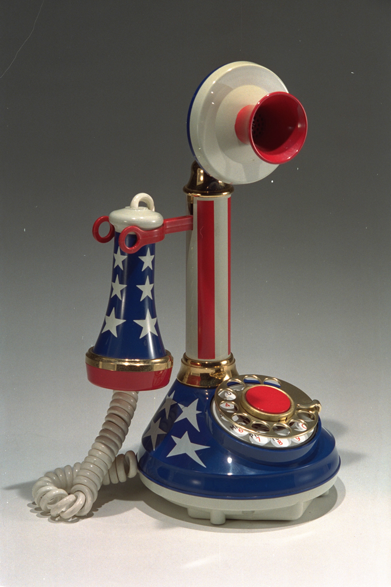 Upright telephone decorated with stripes and stars, in red, white, and blue