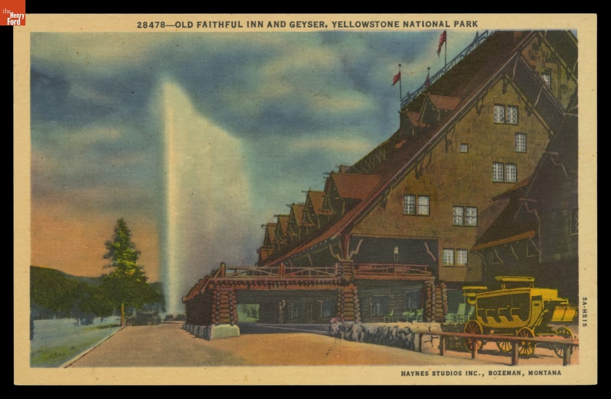 Old Faithful Inn and Geyser, Yellowstone National Park, 1935 Postcard showing side and sliver of front of large, steeply-roofed rustic building with a geyser erupting in the background