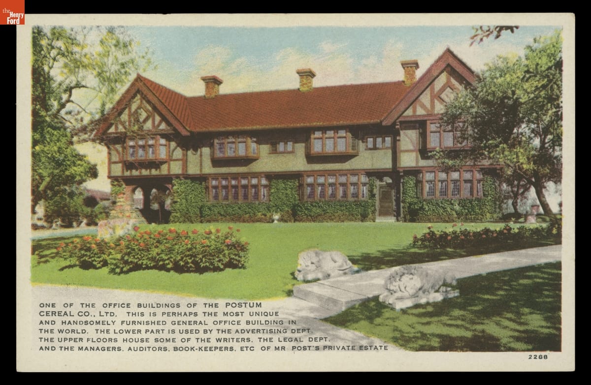 Building seen across lawn and garden