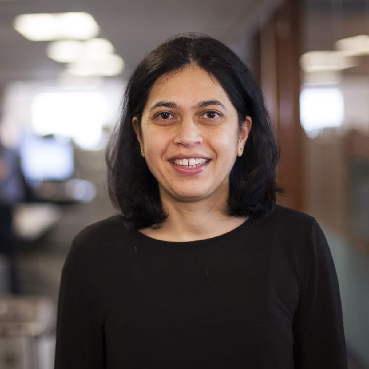 Medium-skinned woman in black top