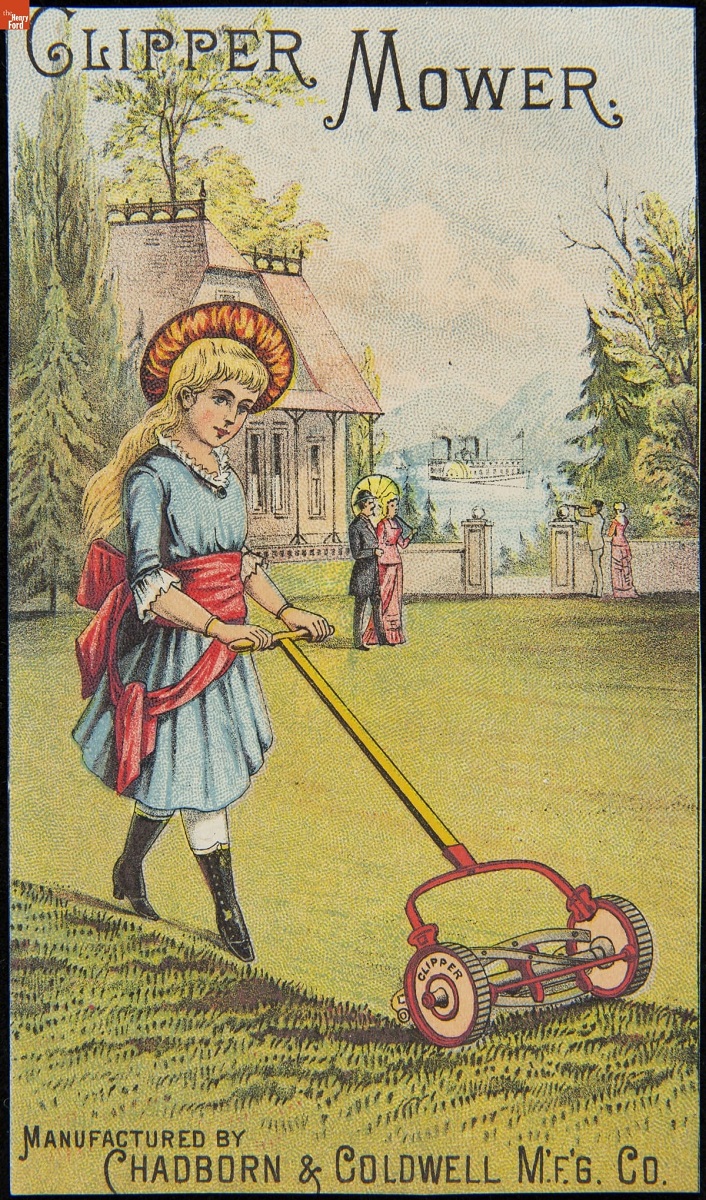Girl in blue dress with red sash pushes reel mower across a lawn in front of a large house 