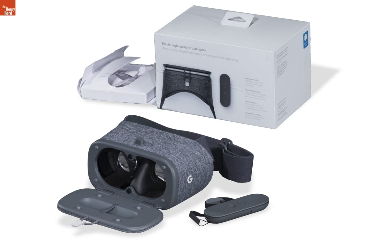 Google "Daydream View" Virtual Reality Headset, 2016-2017 Gray fabric-covered goggles with closure, pictured with box and oval-shaped accessory