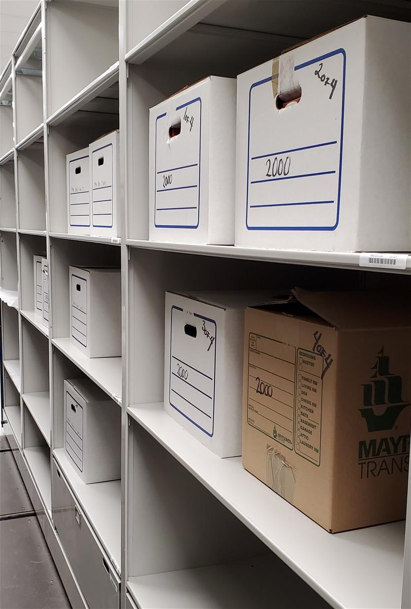 Cardboard boxes on shelves