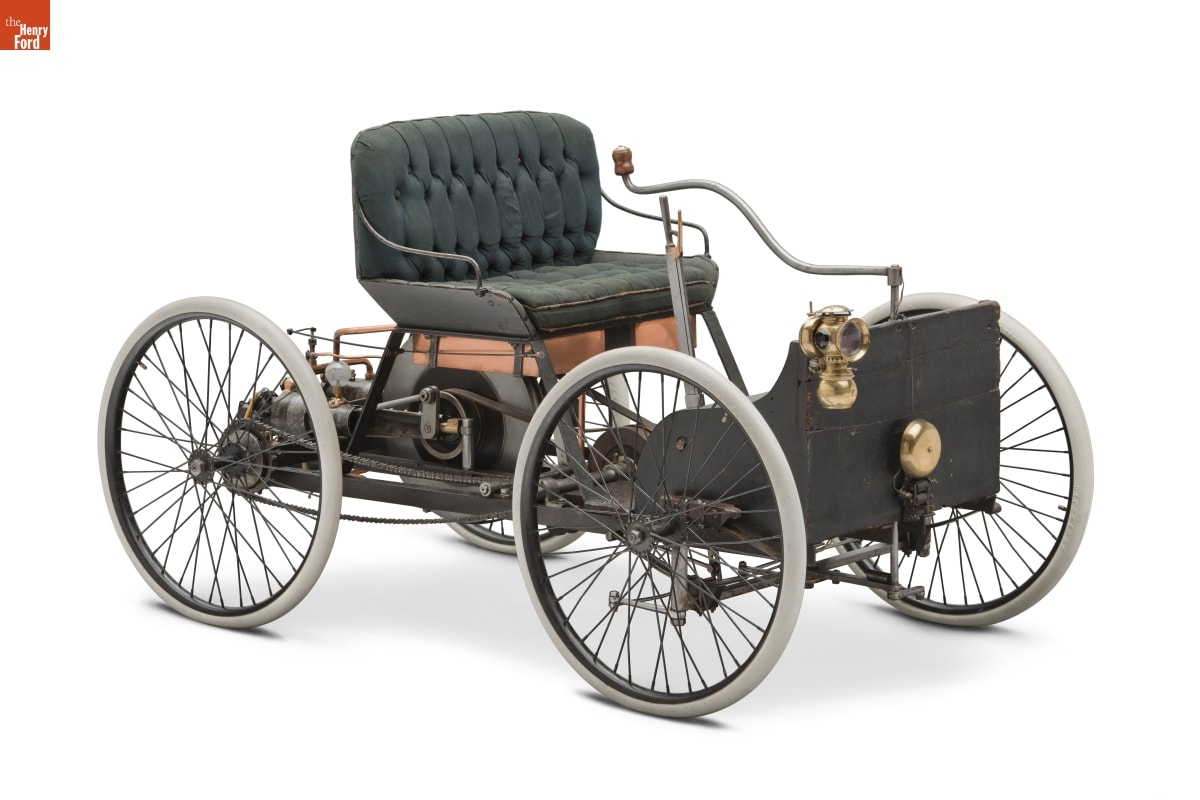 1896 Ford Quadricycle Runabout, First Car Built by Henry Ford Open car with green upholstered seat and visible mechanics