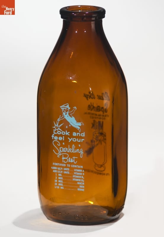 "Blue Boy Sparkle" Milk Bottle, 1934-1955 Brown bottle with blue text and image of boy in overalls with Peter Pan-type hat