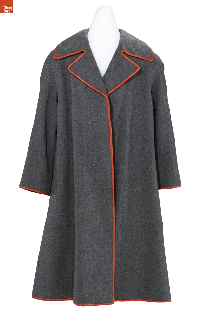Charcoal gray wool coat with red leather piping around the collar and down the placket