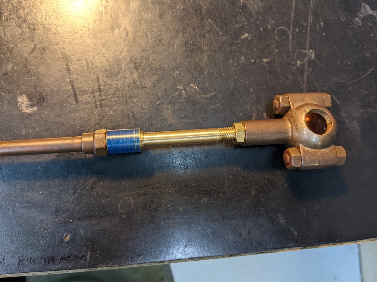 Metal piping or tubing with round shape with bolts on end