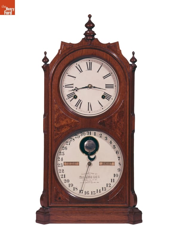 "Double Dial Calendar" Shelf Clock, 1881-1885 Wooden clock with upper face showing time and lower face showing weekday